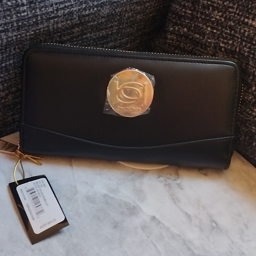 All 4 Bebe WALLET FOR  $70 PLEASE MESSAGE IF INTERESTED